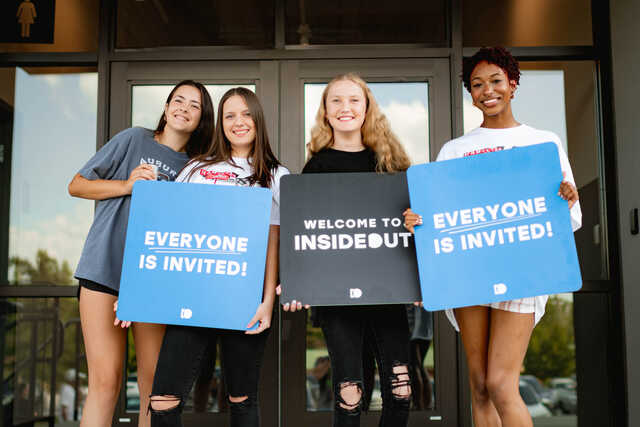 students welcoming guests to insideout