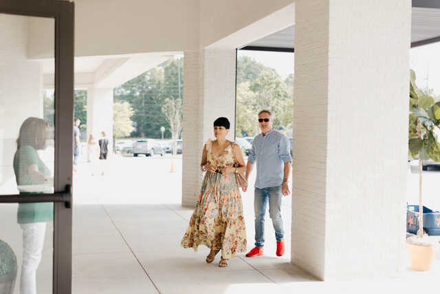 Couple walking into church on a Sunday morning.