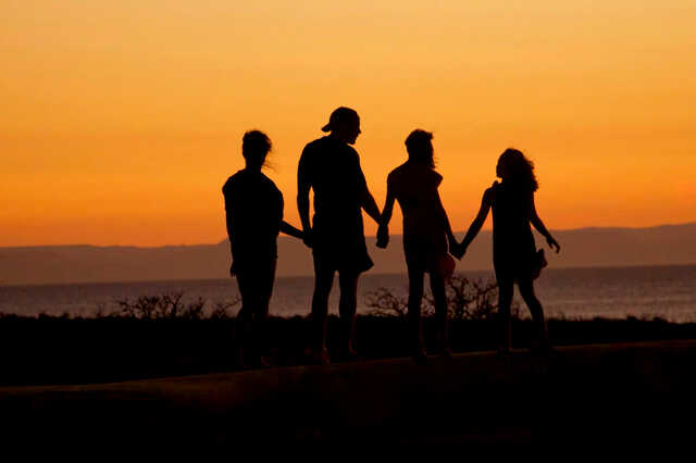 silhouette of family at sunset