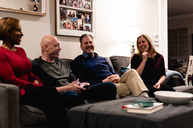 married couples laughing together at community group